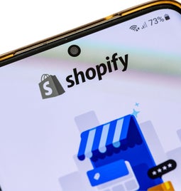 phone with Shopify logo on the screen