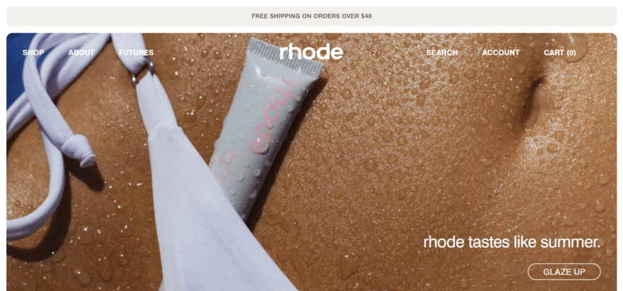 Rhode skin website, featuring a large image of a lip product tucked into bikini bottoms